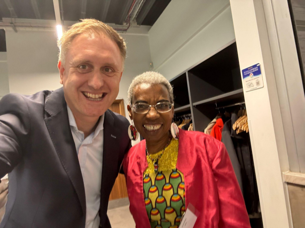 Ed and Rachel Walton, CEO of African Families in the UK, smile for a selfie.