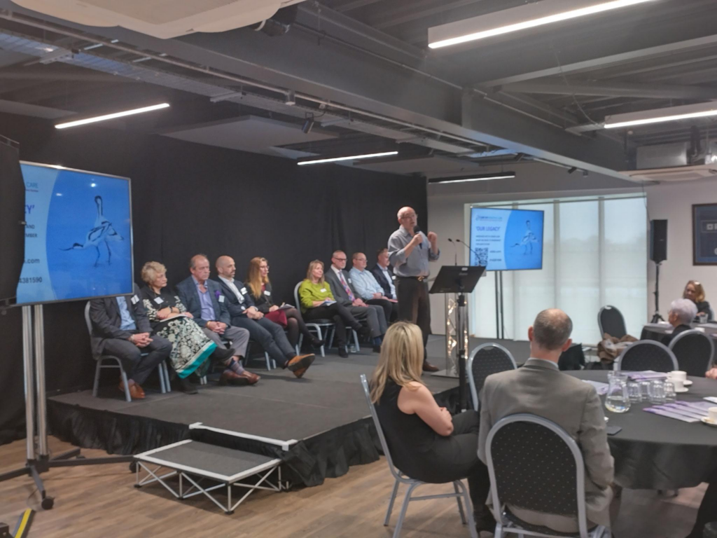 Will Pope speaks on stage at the SNEE Legacy Learning Event