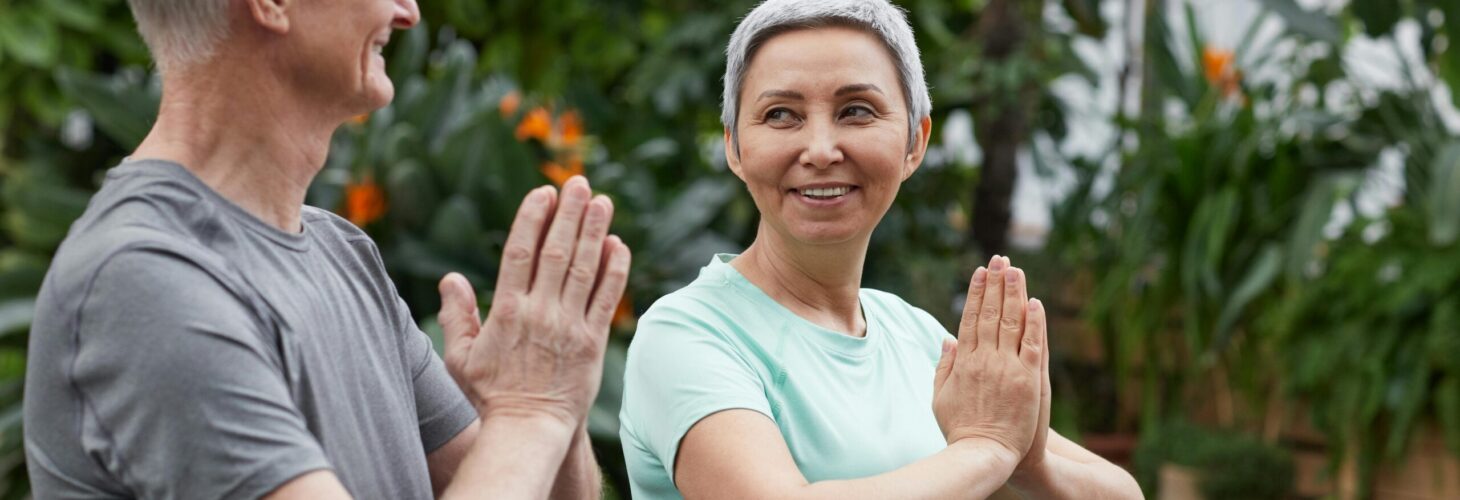 man and woman in yoga pose